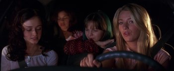Movie still from “The Sisterhood of the Traveling Pants” (2005), directed by Ken Kwapis – A group of young women sitting in a car; Medium shot, Low angle