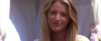 Movie still from “The Sisterhood of the Traveling Pants” (2005), directed by Ken Kwapis – A woman smiling for the camera; Close Up shot, Over the shoulder angle