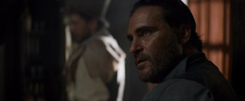 Movie still from “The Sisters Brothers” (2018), directed by Jacques Audiard – A person with a beard; Close Up shot, Over the shoulder angle
