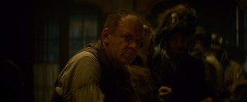 Movie still from “The Sisters Brothers” (2018), directed by Jacques Audiard – A person wearing a shirt; Close Up shot, Over the shoulder angle