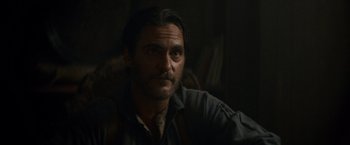 Movie still from “The Sisters Brothers” (2018), directed by Jacques Audiard – A person with a beard; Close Up shot, Over the shoulder angle