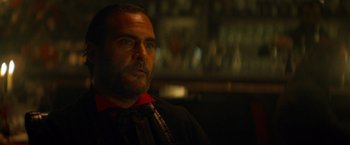 Movie still from “The Sisters Brothers” (2018), directed by Jacques Audiard – A person in a room; Close Up shot, Over the shoulder angle