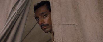 Movie still from “The Sisters Brothers” (2018), directed by Jacques Audiard – A person looking at the camera; Close Up shot, High angle