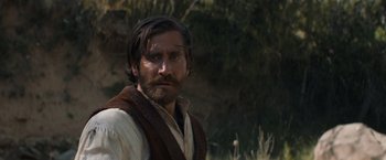 Movie still from “The Sisters Brothers” (2018), directed by Jacques Audiard – A person with a beard; Close Up shot, Over the shoulder angle