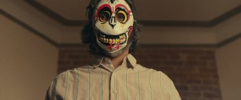 Movie still from “The Skeleton Twins” (2014), directed by Craig Johnson – A man wearing a skull face mask with long hair; Close Up shot, Low angle