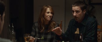 Movie still from “The Skeleton Twins” (2014), directed by Craig Johnson – A woman holding a fork and a piece of broccoli; Medium shot, Over the shoulder angle