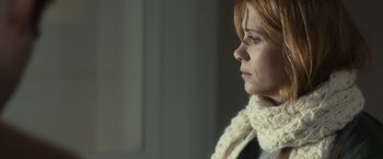 Movie still from “The Skeleton Twins” (2014), directed by Craig Johnson – A person wearing a scarf; Close Up shot, Over the shoulder angle
