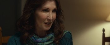 Movie still from “The Skeleton Twins” (2014), directed by Craig Johnson – A person with long hair wearing a scarf; Close Up shot, Over the shoulder angle