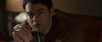 Movie still from “The Skeleton Twins” (2014), directed by Craig Johnson – A person sitting on a couch with his hand under his chin; Close Up shot, Over the shoulder angle