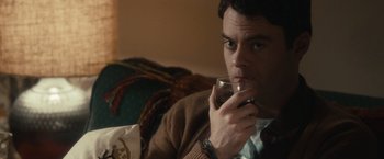 Movie still from “The Skeleton Twins” (2014), directed by Craig Johnson – A man sitting on a couch holding a glass of wine; Close Up shot, Over the shoulder angle