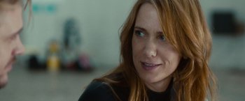 Movie still from “The Skeleton Twins” (2014), directed by Craig Johnson – A person with long red hair; Close Up shot, Over the shoulder angle