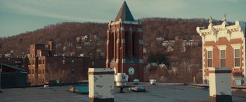 Movie still from “The Skeleton Twins” (2014), directed by Craig Johnson – A large clock tower in the middle of a city; Extreme Wide shot, High angle