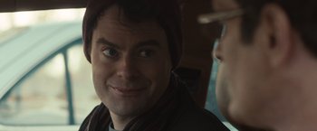 Movie still from “The Skeleton Twins” (2014), directed by Craig Johnson – A man in a hat and a scarf is looking at the camera; Close Up shot, Over the shoulder angle