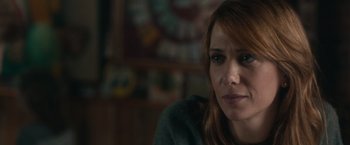 Movie still from “The Skeleton Twins” (2014), directed by Craig Johnson – A person sitting in a room; Close Up shot, Over the shoulder angle