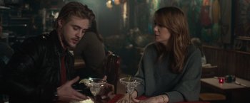 Movie still from “The Skeleton Twins” (2014), directed by Craig Johnson – A man and a woman sitting at a table; Medium shot, Over the shoulder angle