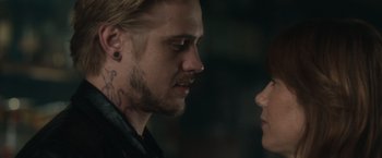 Movie still from “The Skeleton Twins” (2014), directed by Craig Johnson – A person with a tattoo on their face; Close Up shot, Over the shoulder angle