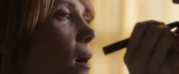 Movie still from “The Skeleton Twins” (2014), directed by Craig Johnson – A woman's face while using a makeup brush; Extreme Close Up shot, Low angle
