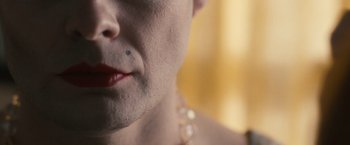 Movie still from “The Skeleton Twins” (2014), directed by Craig Johnson – A person's face with a tattoo on it; Extreme Close Up shot, Overhead angle