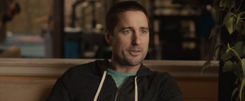 Movie still from “The Skeleton Twins” (2014), directed by Craig Johnson – A person sitting in a room; Close Up shot, Over the shoulder angle