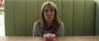Movie still from “The Skeleton Twins” (2014), directed by Craig Johnson – A woman sitting in front of a bowl of ice cream; Close Up shot, Over the shoulder angle