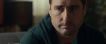 Movie still from “The Skeleton Twins” (2014), directed by Craig Johnson – A person wearing a green shirt; Close Up shot, Over the shoulder angle