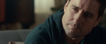 Movie still from “The Skeleton Twins” (2014), directed by Craig Johnson – A person wearing a black sweater; Close Up shot, Over the shoulder angle