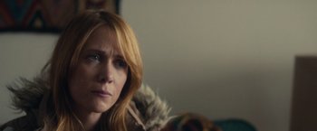 Movie still from “The Skeleton Twins” (2014), directed by Craig Johnson – A person with a bird in a room; Close Up shot, Over the shoulder angle