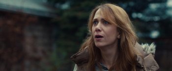Movie still from “The Skeleton Twins” (2014), directed by Craig Johnson – A person with long red hair; Close Up shot, Over the shoulder angle