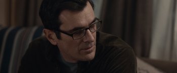 Movie still from “The Skeleton Twins” (2014), directed by Craig Johnson – A person wearing glasses and a jacket; Close Up shot, Over the shoulder angle