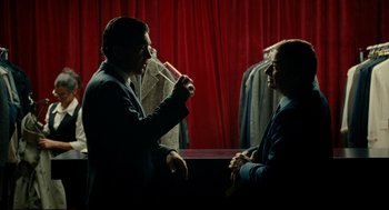 Movie still from “The Skin I Live In” (2011), directed by Pedro Almodóvar – Two men in business suits are having a conversation; Medium shot, Over the shoulder angle