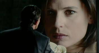 Movie still from “The Skin I Live In” (2011), directed by Pedro Almodóvar – A woman's face and a man's face; Extreme Close Up shot, Over the shoulder angle