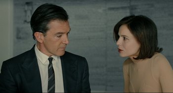 Movie still from “The Skin I Live In” (2011), directed by Pedro Almodóvar – A man and a woman are talking to each other; Close Up shot, Over the shoulder angle