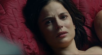 Movie still from “The Skin I Live In” (2011), directed by Pedro Almodóvar – A person laying on the ground; Close Up shot, Overhead angle