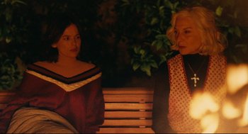 Movie still from “The Skin I Live In” (2011), directed by Pedro Almodóvar – Two women are sitting on a bench at night; Medium shot, Over the shoulder angle