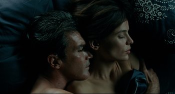 Movie still from “The Skin I Live In” (2011), directed by Pedro Almodóvar – A man and a woman laying next to each other; Close Up shot, Overhead angle