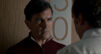 Movie still from “The Skin I Live In” (2011), directed by Pedro Almodóvar – A person looking at the camera; Close Up shot, Over the shoulder angle