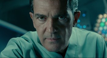 Movie still from “The Skin I Live In” (2011), directed by Pedro Almodóvar – A man's face in a green shirt; Close Up shot, Low angle