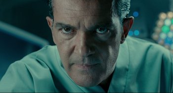 Movie still from “The Skin I Live In” (2011), directed by Pedro Almodóvar – A man's face in a green shirt; Close Up shot, Low angle