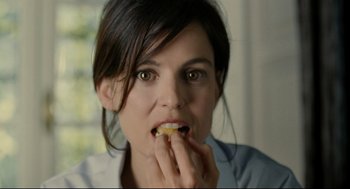 Movie still from “The Skin I Live In” (2011), directed by Pedro Almodóvar – A person eating food; Close Up shot, Over the shoulder angle