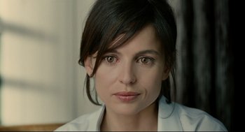 Movie still from “The Skin I Live In” (2011), directed by Pedro Almodóvar – A person wearing a white shirt; Close Up shot, Over the shoulder angle