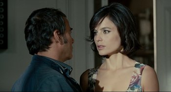Movie still from “The Skin I Live In” (2011), directed by Pedro Almodóvar – A man and a woman standing next to each other; Close Up shot, Over the shoulder angle