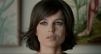 Movie still from “The Skin I Live In” (2011), directed by Pedro Almodóvar – A person with short black hair; Close Up shot, High angle