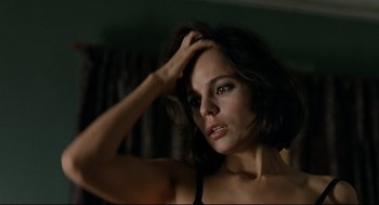 Movie still from “The Skin I Live In” (2011), directed by Pedro Almodóvar – A beautiful woman with dark brown hair posing for a picture; Close Up shot, High angle