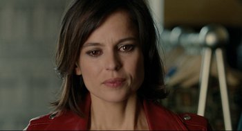 Movie still from “The Skin I Live In” (2011), directed by Pedro Almodóvar – A person wearing a red jacket; Close Up shot, Over the shoulder angle