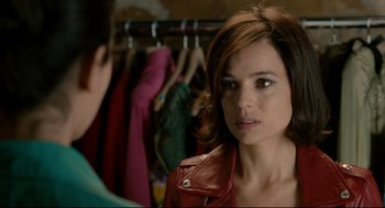 Movie still from “The Skin I Live In” (2011), directed by Pedro Almodóvar – A person wearing a red leather jacket; Close Up shot, Over the shoulder angle