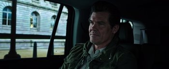Movie still from “Sicario: Day of the Soldado” (2018), directed by Stefano Sollima – A person sitting in a car; Close Up shot, Over the shoulder angle