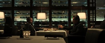 Movie still from “Sicario: Day of the Soldado” (2018), directed by Stefano Sollima – Two men sitting at a table in front of wine glasses; Medium shot, Over the shoulder angle