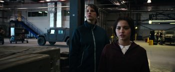 Movie still from “Sicario: Day of the Soldado” (2018), directed by Stefano Sollima – Two women standing next to each other in a warehouse; Medium shot, Low angle