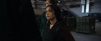 Movie still from “Sicario: Day of the Soldado” (2018), directed by Stefano Sollima – A woman standing next to another woman in a warehouse; Close Up shot, Over the shoulder angle