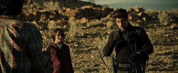 Movie still from “Sicario: Day of the Soldado” (2018), directed by Stefano Sollima – A man and a woman standing in the desert; Medium shot, Over the shoulder angle